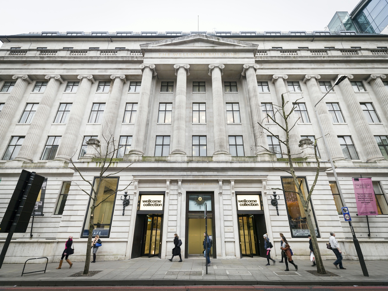 The imposing white edifice of a neoclassical 1930s building. Wellcome Collection building, Euston Road, London, UK.