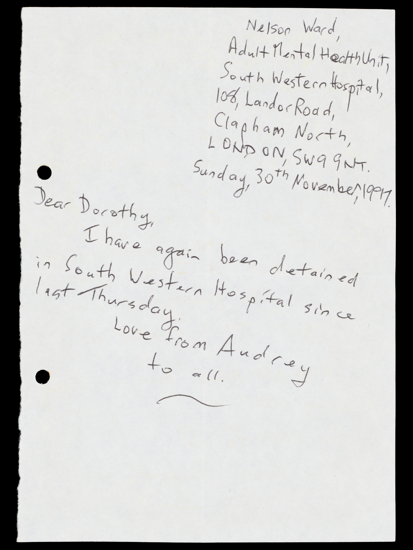 Photograph of a handwritten letter on a sheet of plain paper. In the top right is the sender's address, listed as Nelson Ward in South Western Hospital. The short letter reads, "Dear Dorothy, I have again been detained in South Western Hospital since last Thursday. Love from Audrey to all."