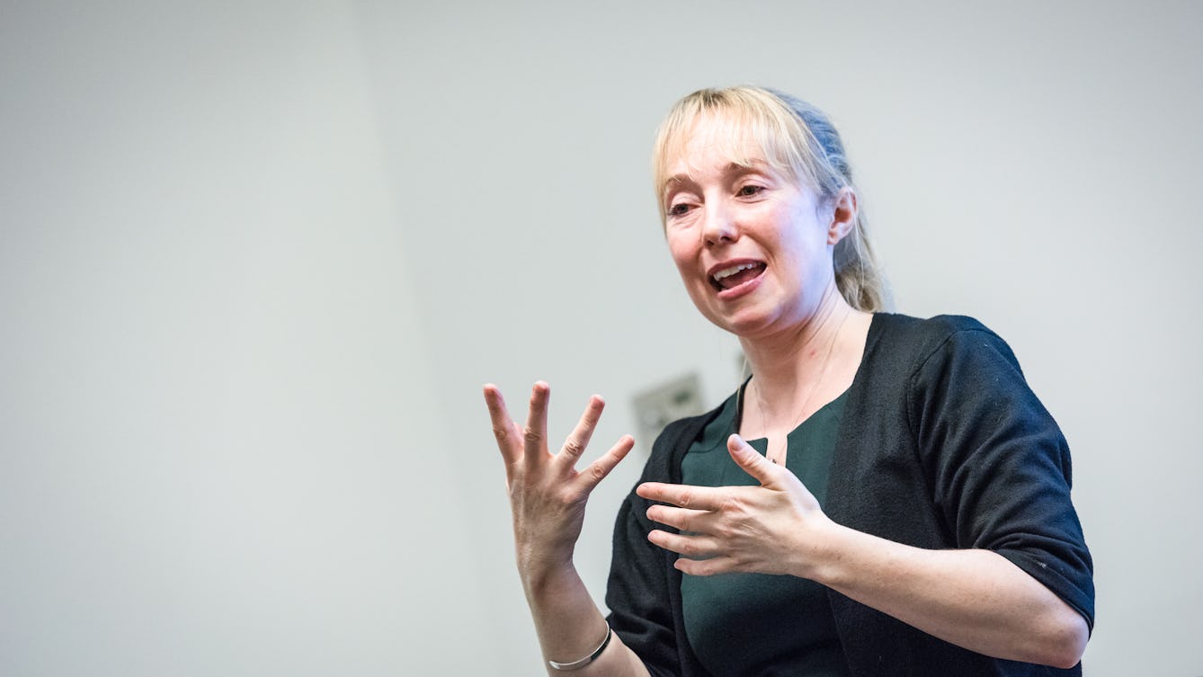 Photograph of a British sign language interpreter translating at the Wellcome Collection.