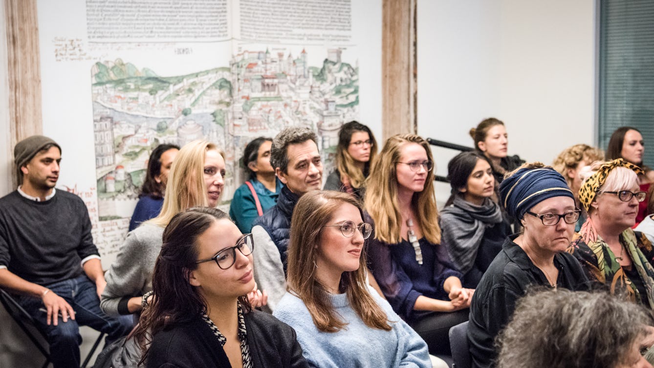 Photograph of a seated audience listening to a speaker in the Viewing Room at Wellcome Collection.