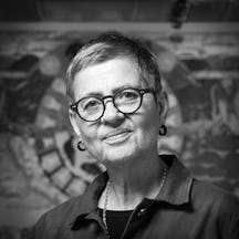 Photographic black and white, head and shoulders portrait of Dr Louise Hide.