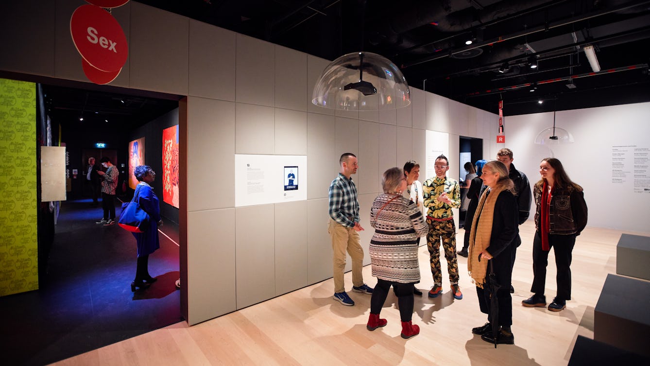 Photograph of people gathered in an exhibition.
