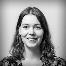 Photographic portrait in black and white, showing the head and shoulders of writer Gwen Smith.