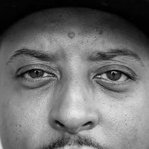 Black and white headshot of Christopher Samuel