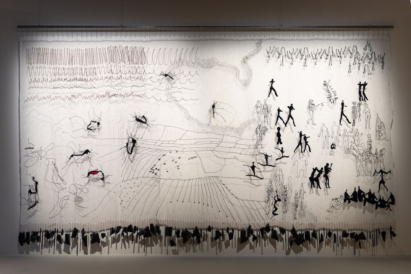 A photograph of 'Mosquito Shrine' on display in our exhibition, Hard Graft.