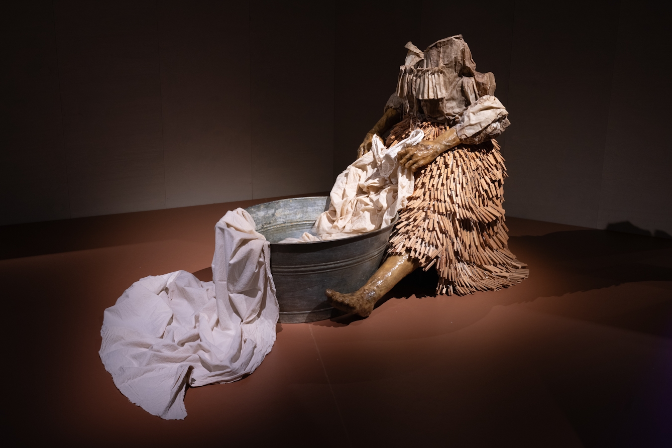 A photograph of a sculpture by Shannon Alonzo called 'Washerwoman'.